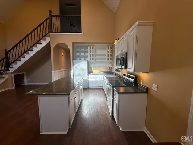 a kitchen with sink cabinets and outdoor view