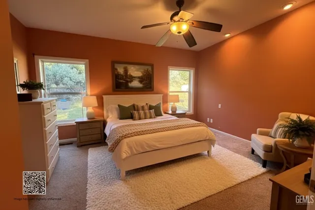 a bedroom with a bed and a couch