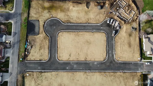 an aerial view of a house with outdoor space