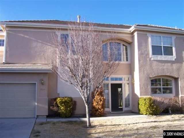 1267 Tule Drive Reno, NV 89521 - Photo 1 of 7 a front view of a house with garden