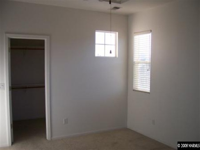 1267 Tule Drive Reno, NV 89521 - Photo 5 of 7 an empty room with windows
