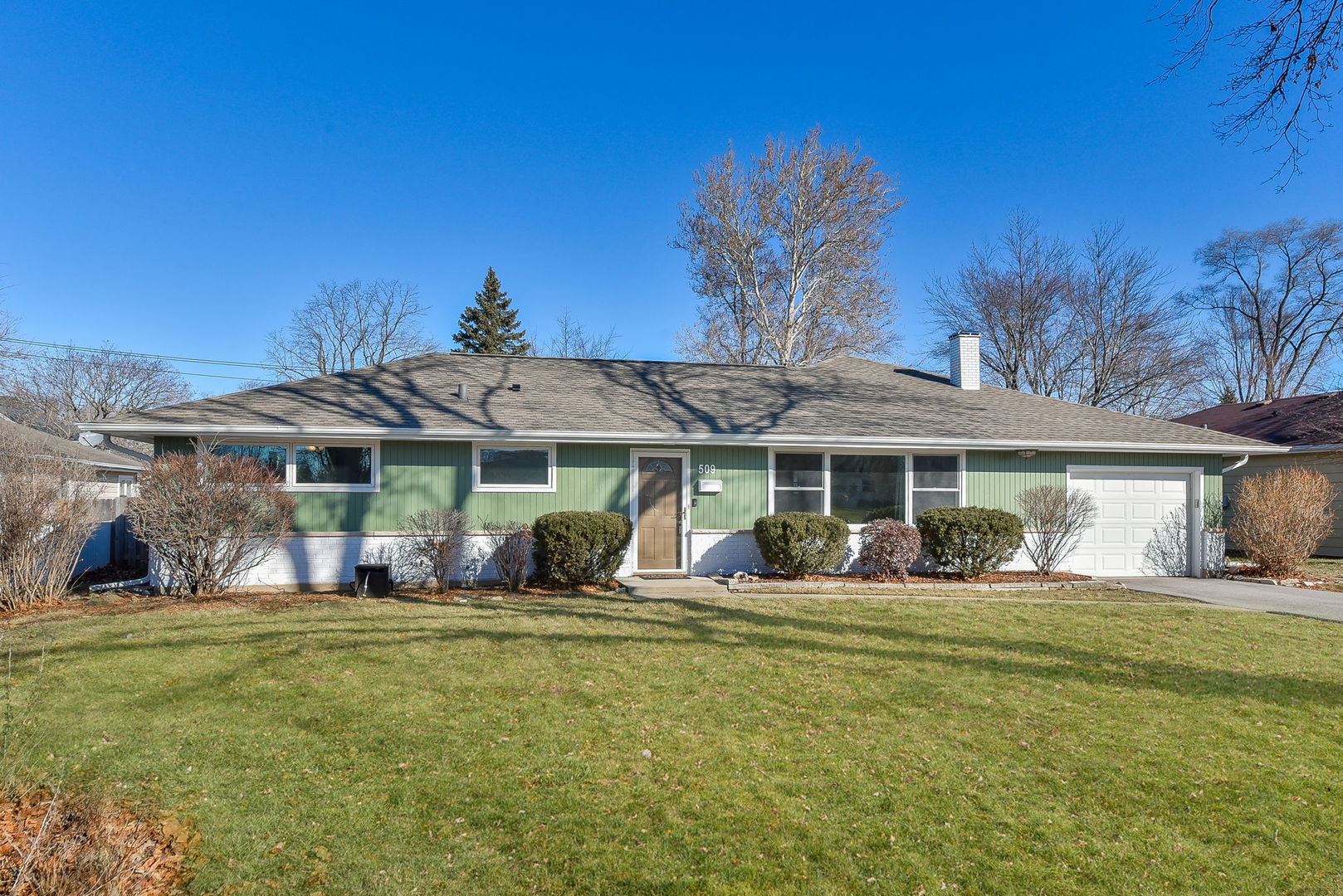 509 Turf Lane Wheaton, IL 60187 - Photo 1 of 16 a front view of a house with a garden and yard