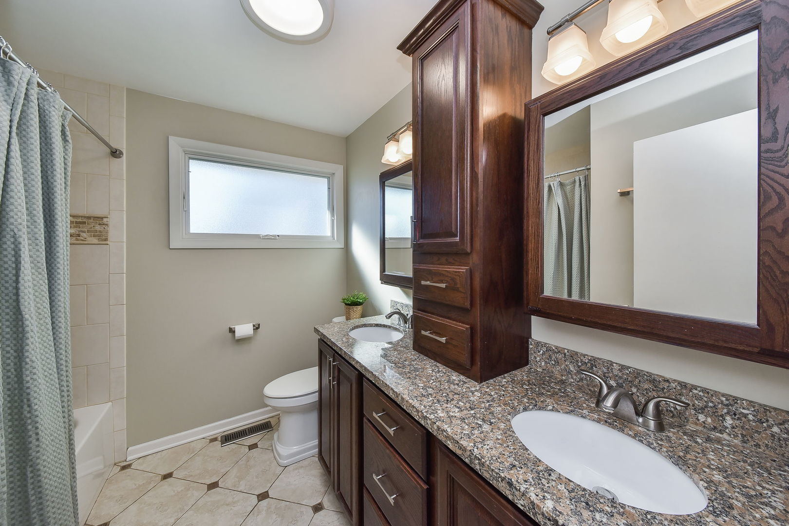 509 Turf Lane Wheaton, IL 60187 - Photo 11 of 16 a bathroom with a granite countertop sink a toilet a mirror and shower