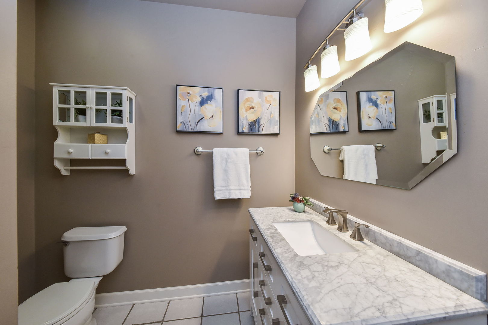 509 Turf Lane Wheaton, IL 60187 - Photo 12 of 16 a bathroom with a granite countertop toilet sink and mirror