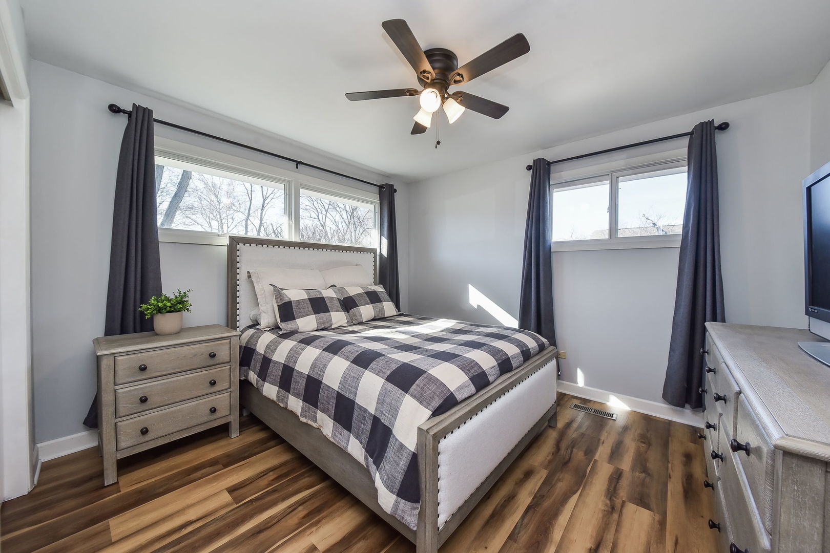 509 Turf Lane Wheaton, IL 60187 - Photo 8 of 16 a bedroom with a large bed and a window