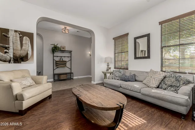 a living room with furniture and a window