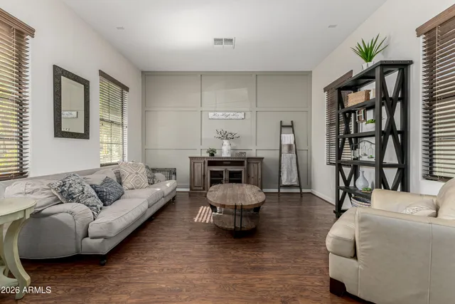 a view of a livingroom with furniture and windows
