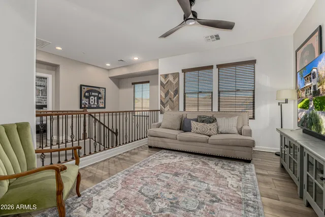 a bedroom with a large bed and dresser