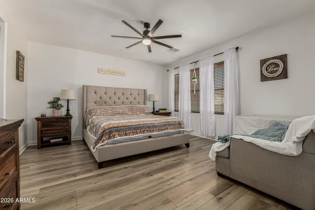 a bathroom with a double vanity sink a mirror and bathtub