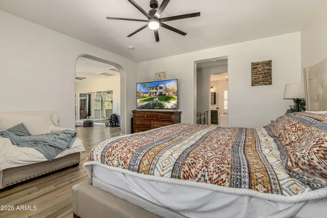 a bedroom with a bed and a desk