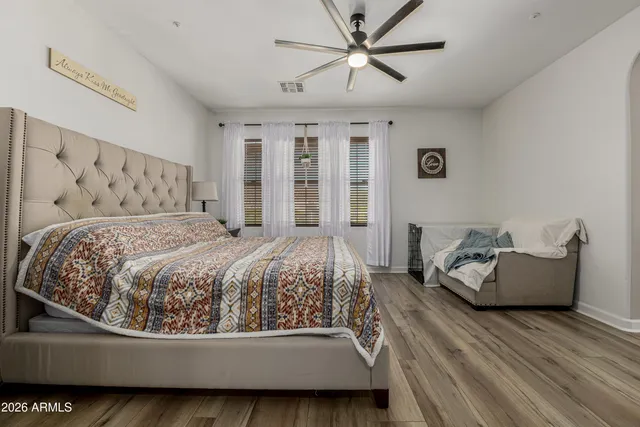 a bedroom with a bed and a table in it