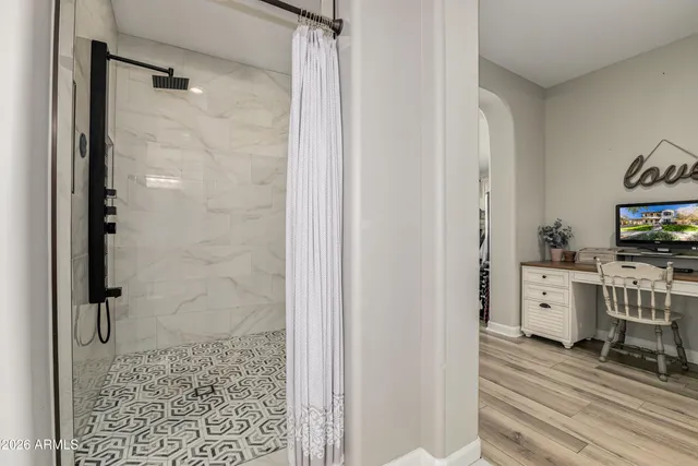 a bedroom with furniture and a window