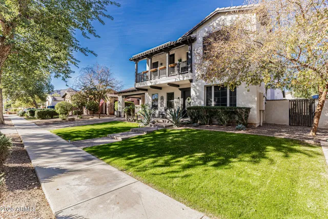 a front view of a house with swimming pool having outdoor seating
