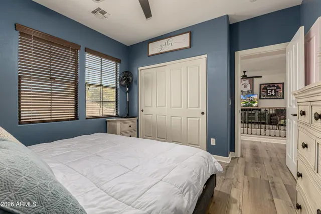 a bedroom with a bed and a desk