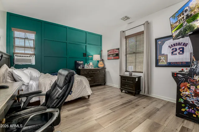 a view of a backyard with table and chairs under an umbrella