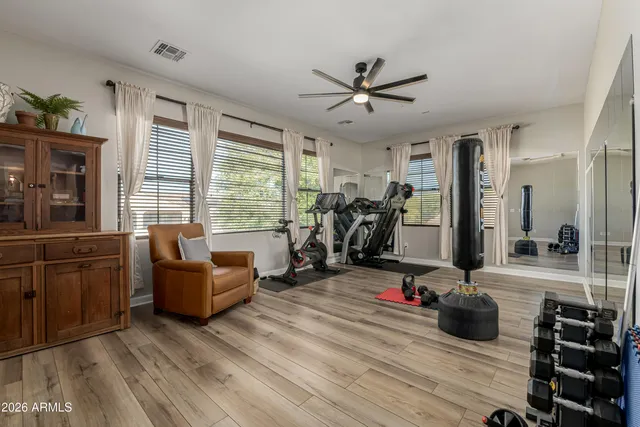 a view of swimming pool with palm trees