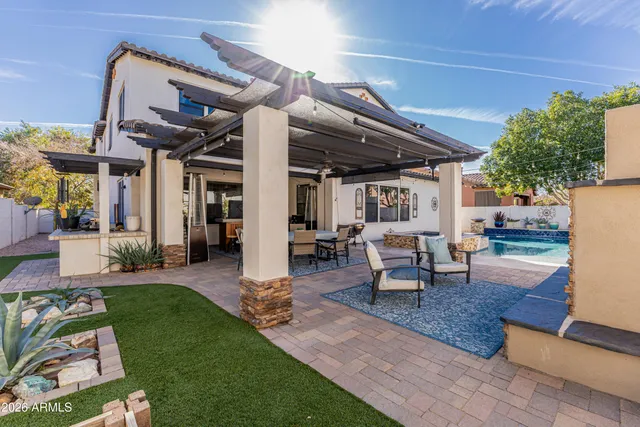 a view of a brick building next to a yard