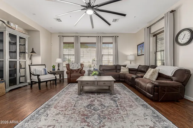 a living room with furniture fireplace and window