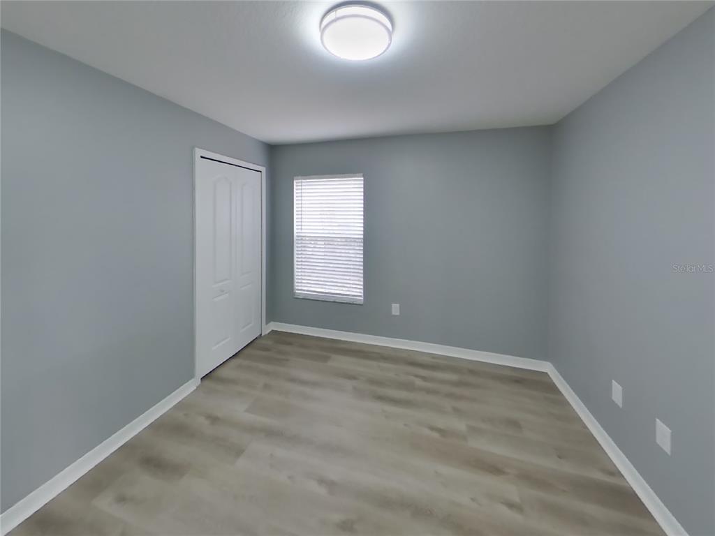 Undisclosed Address Spring Hill, FL 34609 - Photo 11 of 15 an empty room with windows