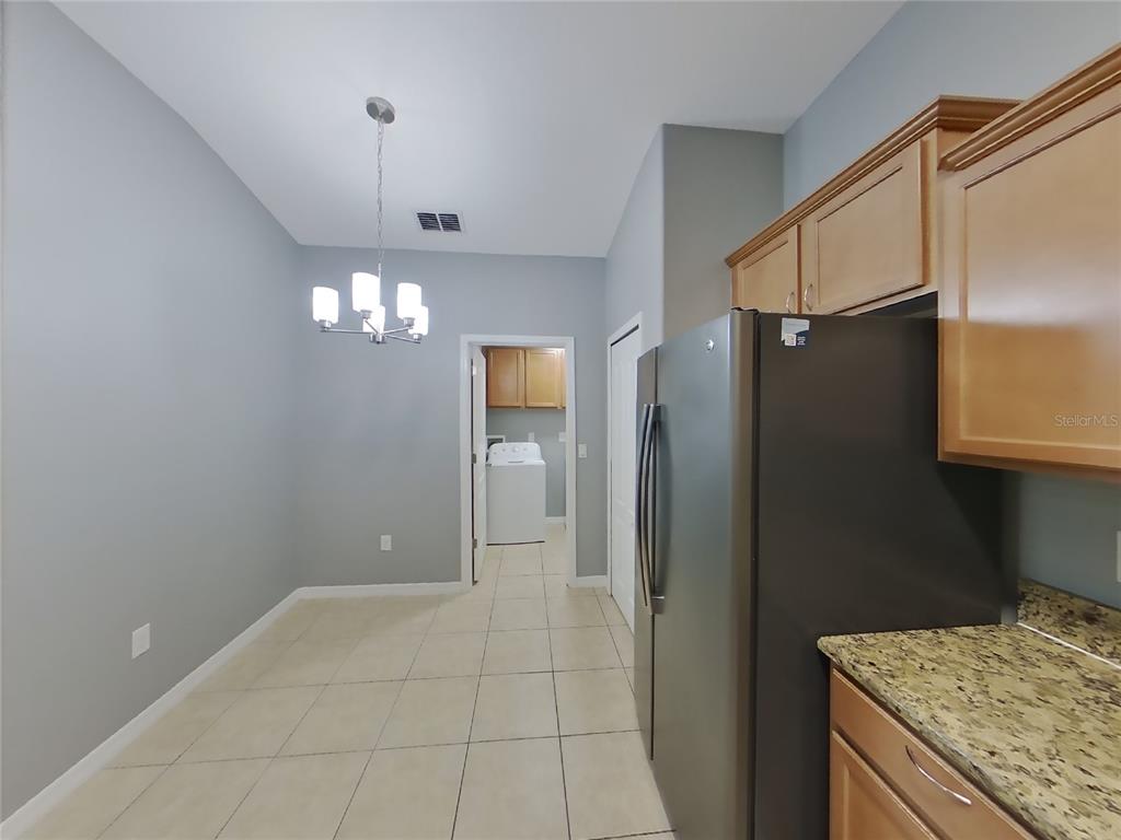Undisclosed Address Spring Hill, FL 34609 - Photo 4 of 15 a bathroom with a granite countertop sink a shower and a mirror