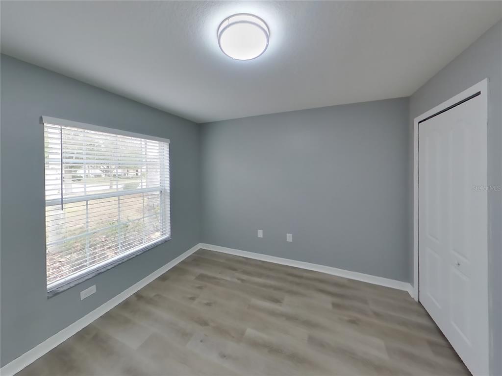 Undisclosed Address Spring Hill, FL 34609 - Photo 10 of 15 an empty room with a window