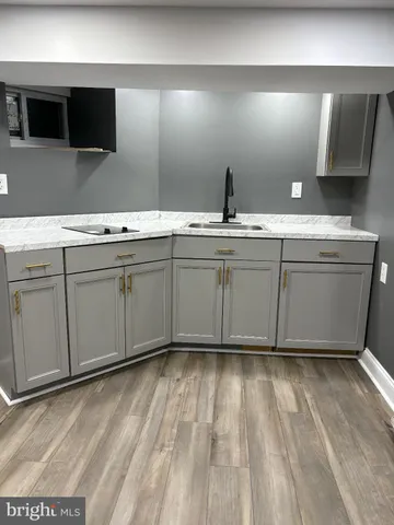 a bathroom with a sink and mirror