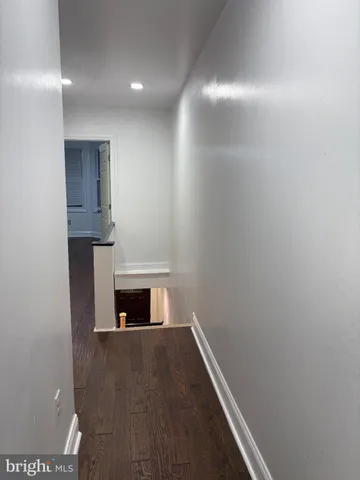 a view of wooden floor in an empty room
