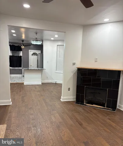 a view of a big room with wooden cabinet and a fireplace