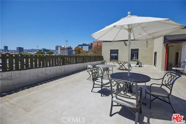 a patio with a table and chairs