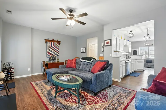 a living room with furniture and a rug