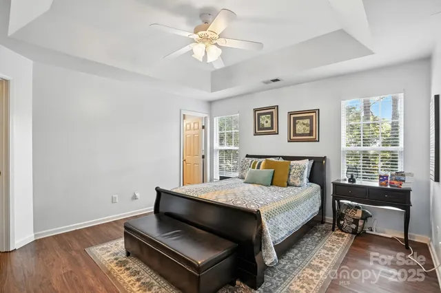 a bedroom with a bed a table and chair