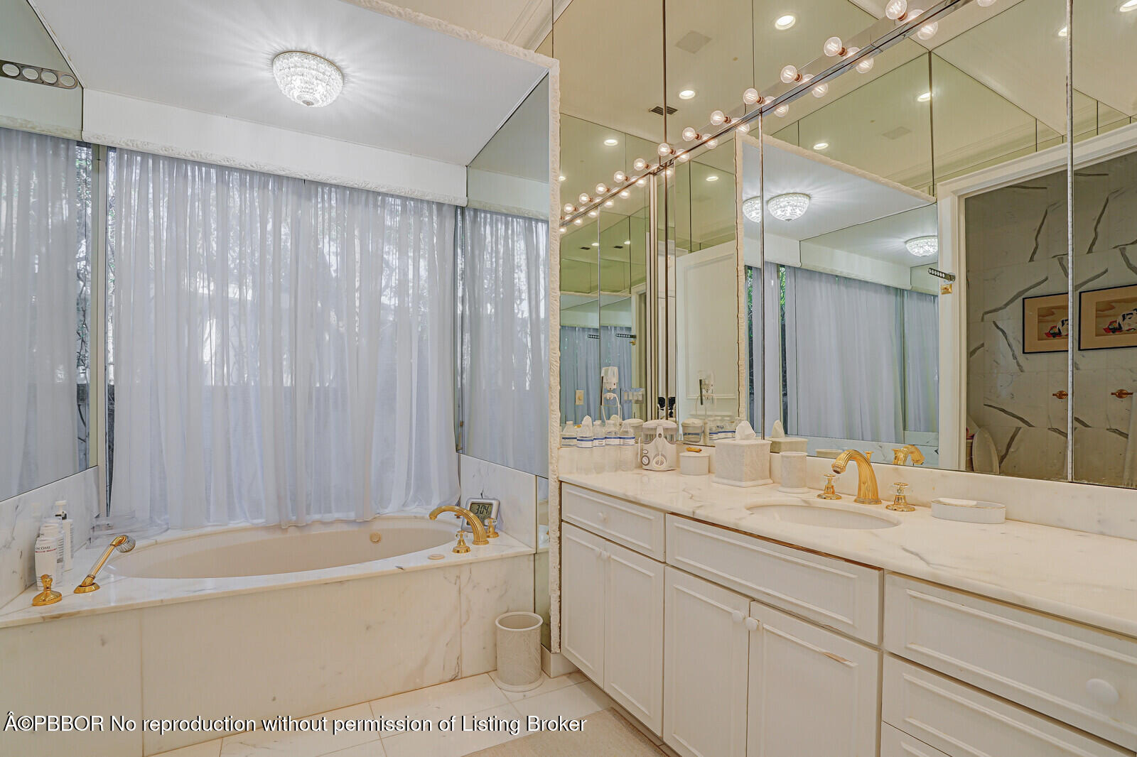 220 Wells Road Palm Beach, FL 33480 - Photo 18 of 30 a bathroom with a tub sink shower and mirror