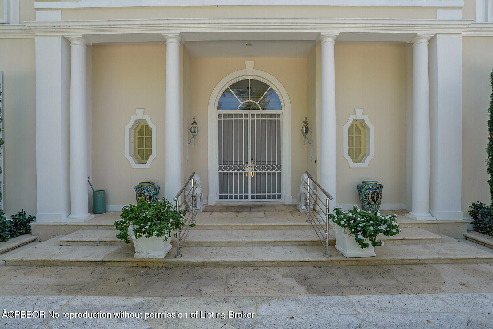 220 Wells Road Palm Beach, FL 33480 - Photo 3 of 30 a front view of a house with a potted plant