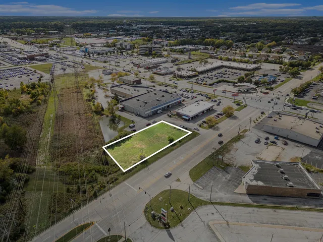 an aerial view of a residential houses with outdoor space