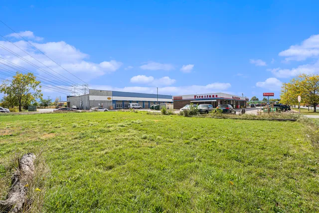 a view of a big yard with houses