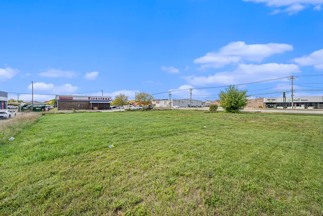 a backyard of a house with lots of green space