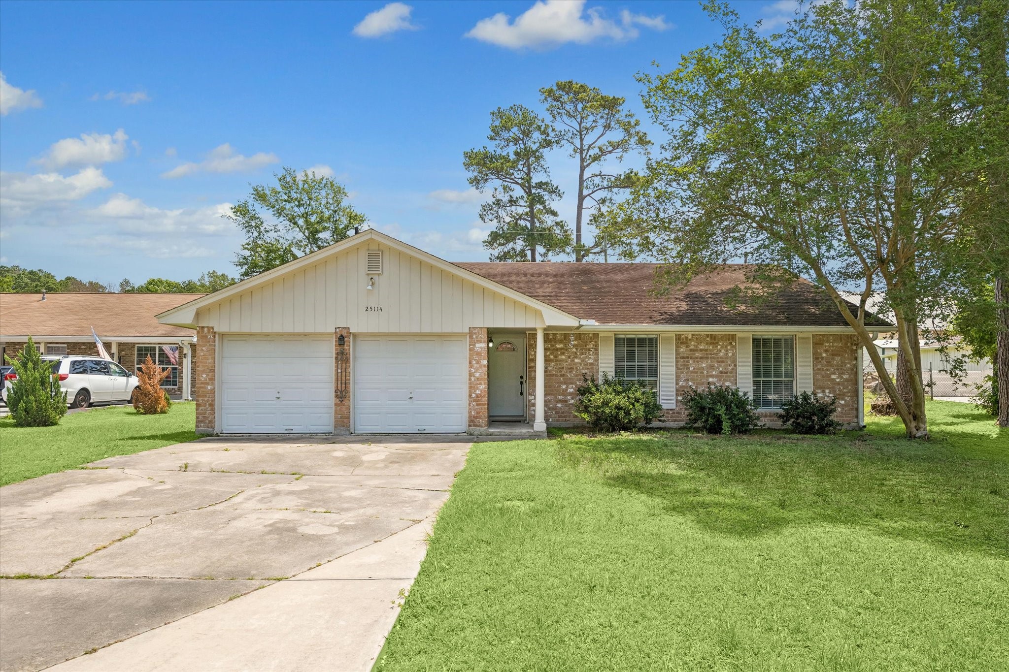 25114 Spring Ridge Drive Spring, TX 77386 - Photo 2 of 24 a front view of a house with a garden
