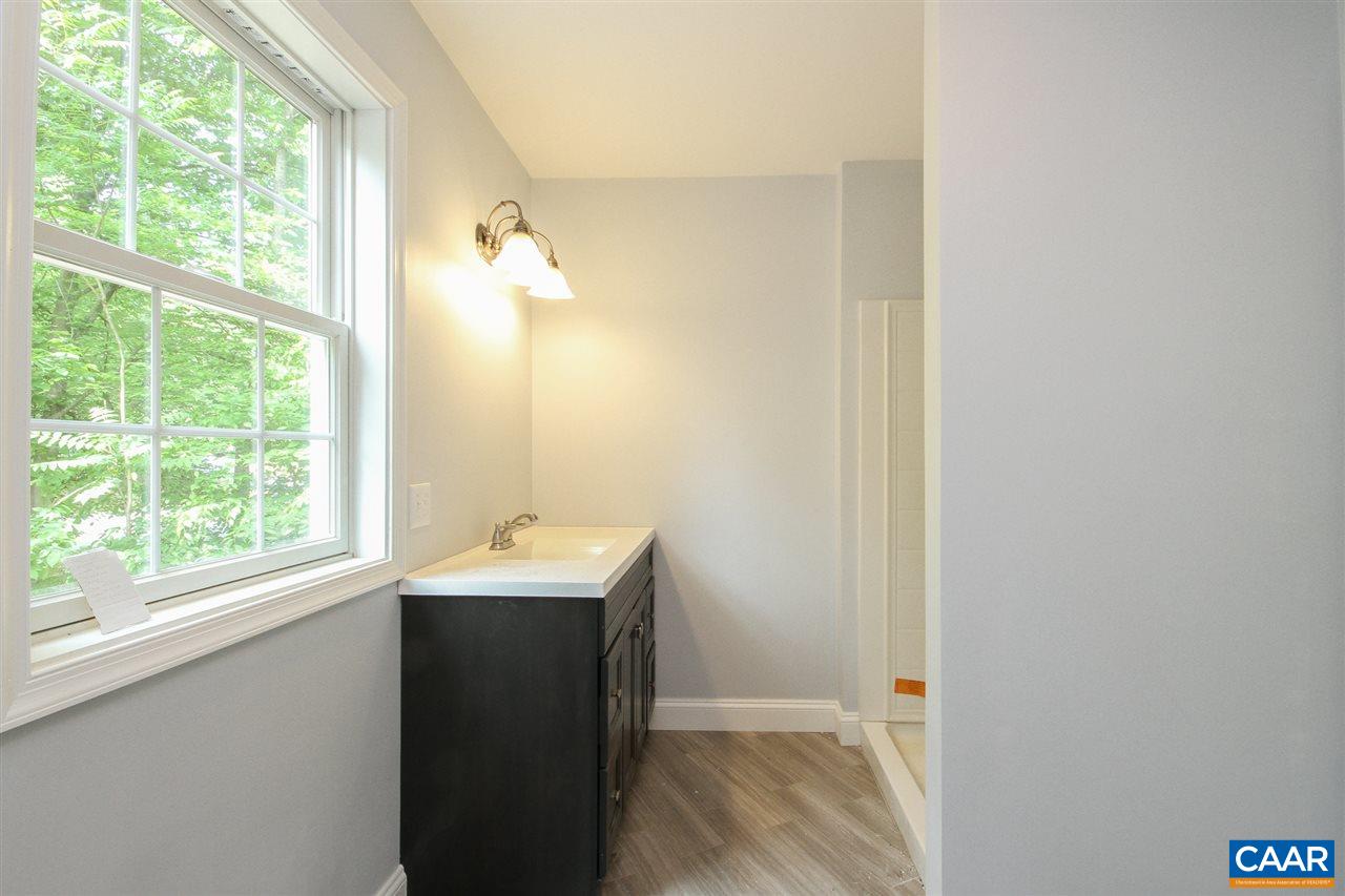38 East Point Road Palmyra, VA 22963 - Photo 11 of 12 a bathroom with a sink and a mirror