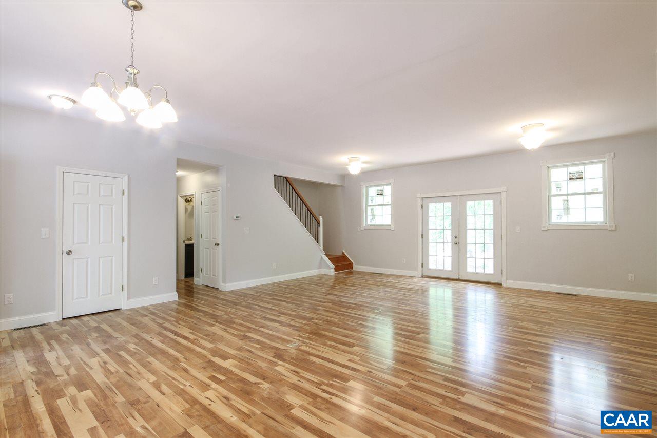 38 East Point Road Palmyra, VA 22963 - Photo 3 of 12 a view of an empty room with wooden floor and a window