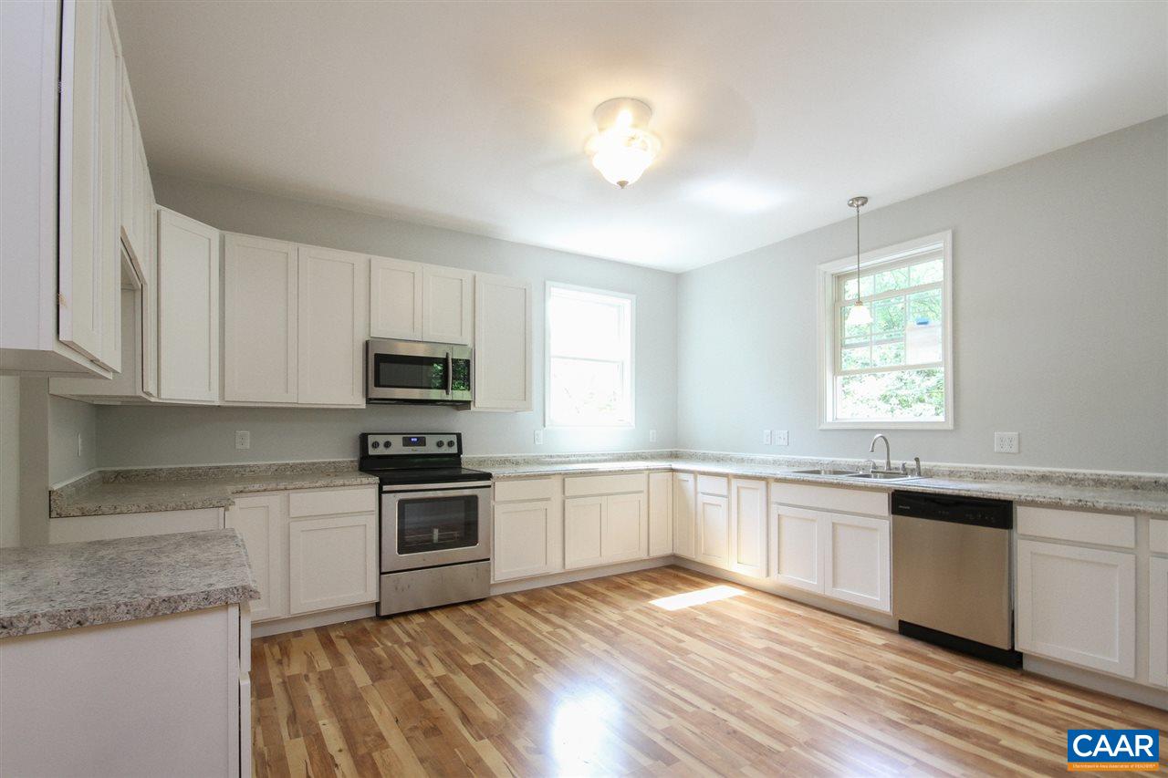 38 East Point Road Palmyra, VA 22963 - Photo 7 of 12 a kitchen with granite countertop a sink and steel appliances