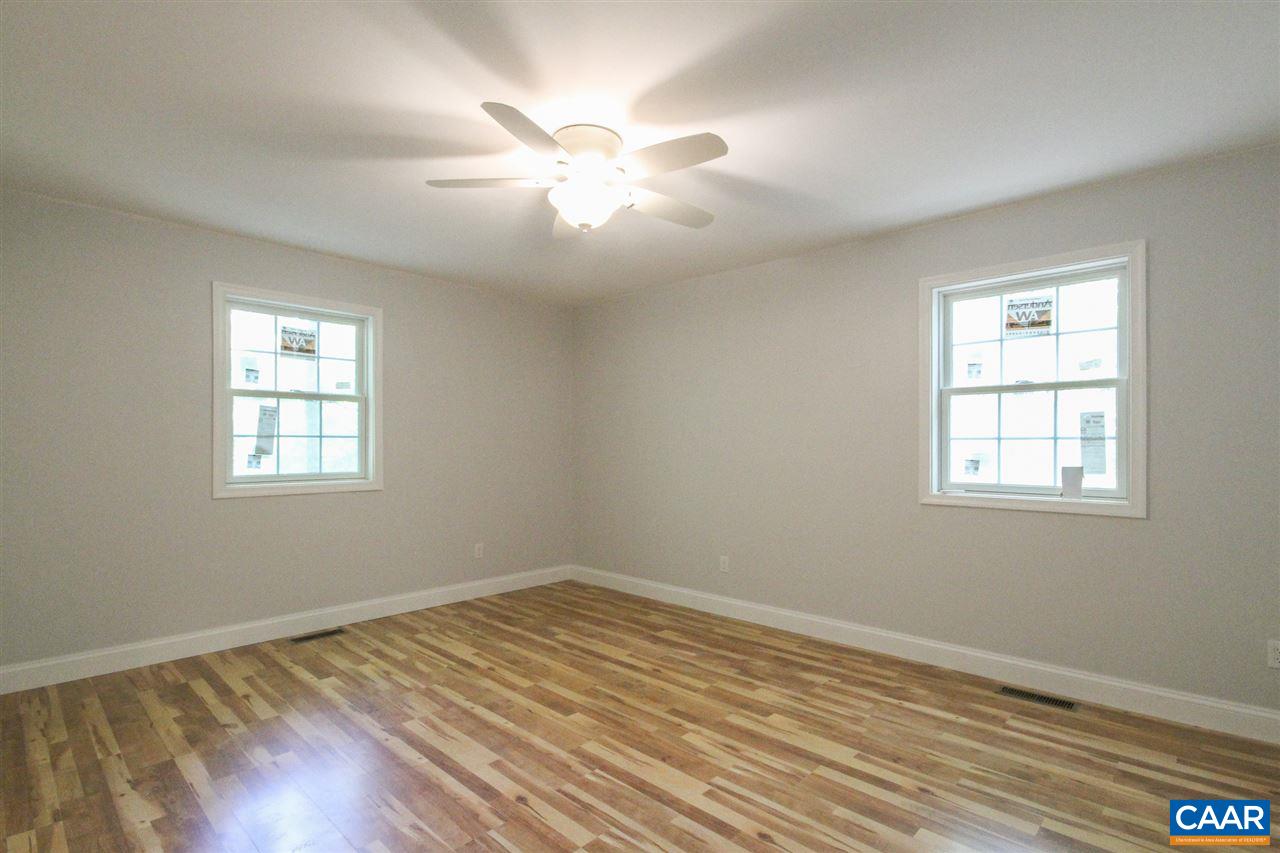 38 East Point Road Palmyra, VA 22963 - Photo 9 of 12 a view of empty room with wooden floor and fan