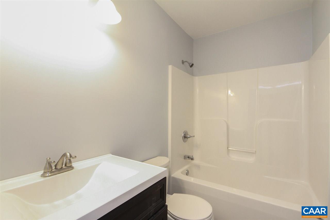 38 East Point Road Palmyra, VA 22963 - Photo 10 of 12 a bathroom with a sink toilet and bathtub