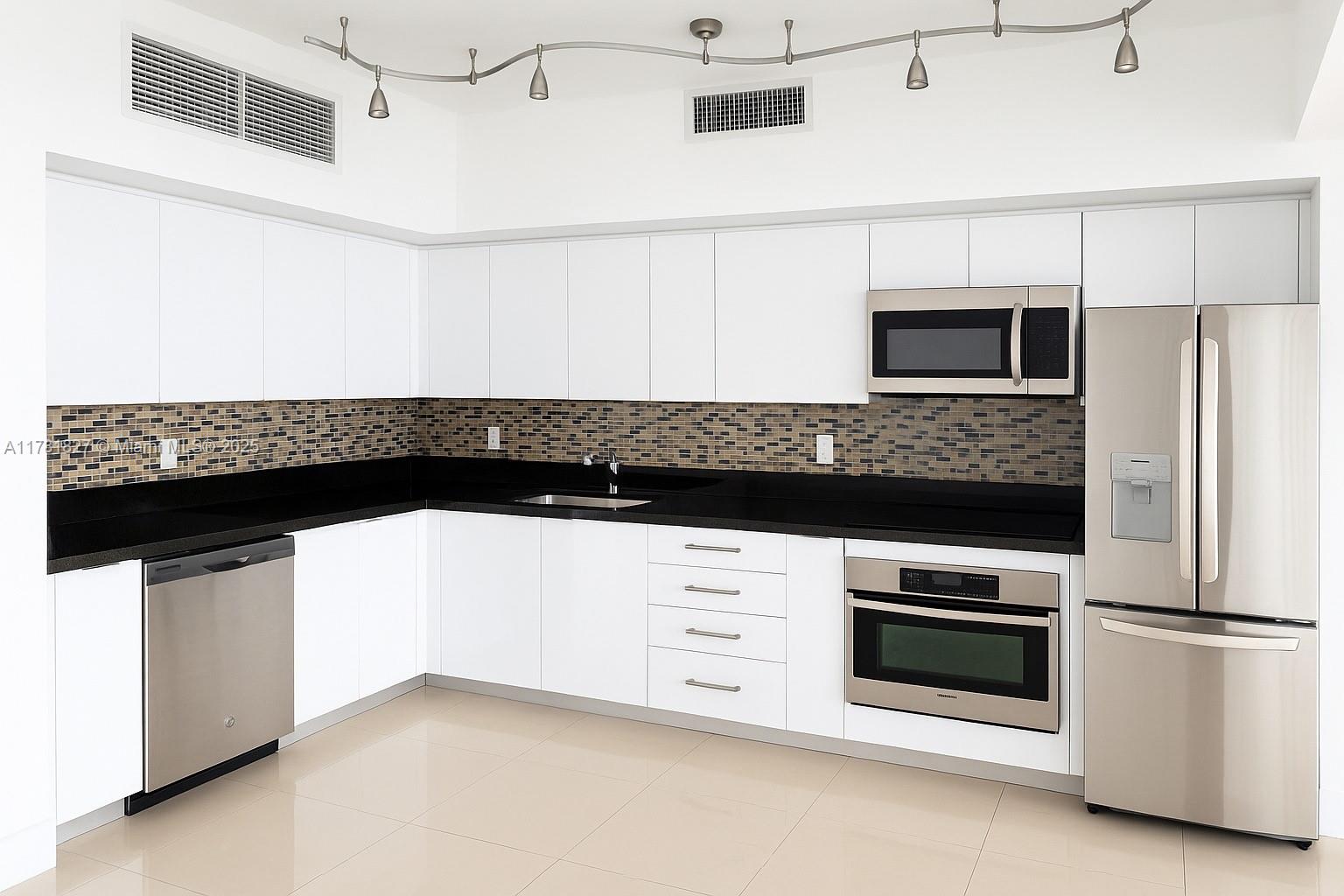 92 Southwest 3rd Street, Unit 4209 Miami, FL 33130 - Photo 1 of 31 a kitchen with granite countertop white cabinets and stainless steel appliances