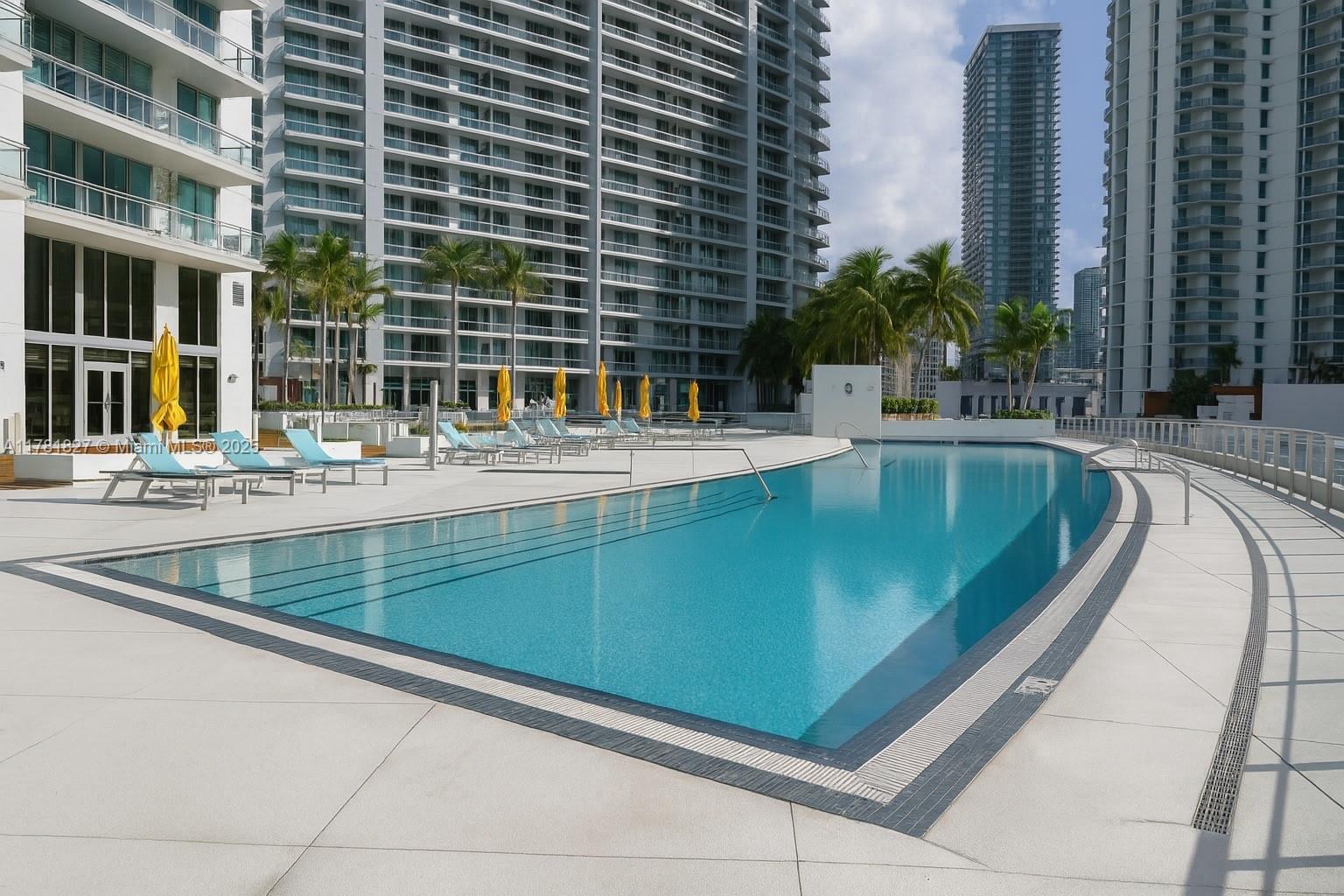 92 Southwest 3rd Street, Unit 4209 Miami, FL 33130 - Photo 15 of 31 a view of a swimming pool with outdoor seating