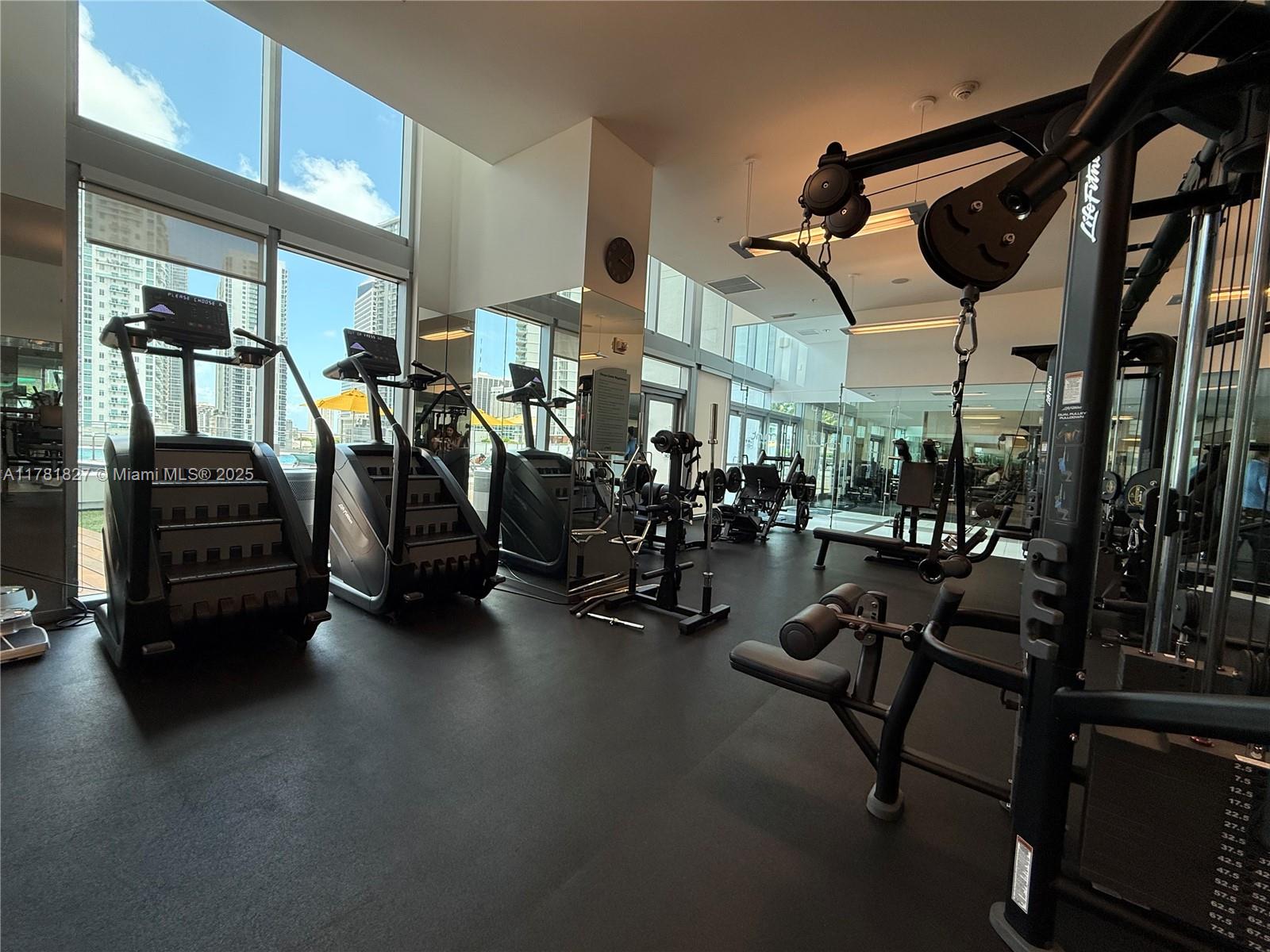 92 Southwest 3rd Street, Unit 4209 Miami, FL 33130 - Photo 23 of 31 a view of a room with gym equipment