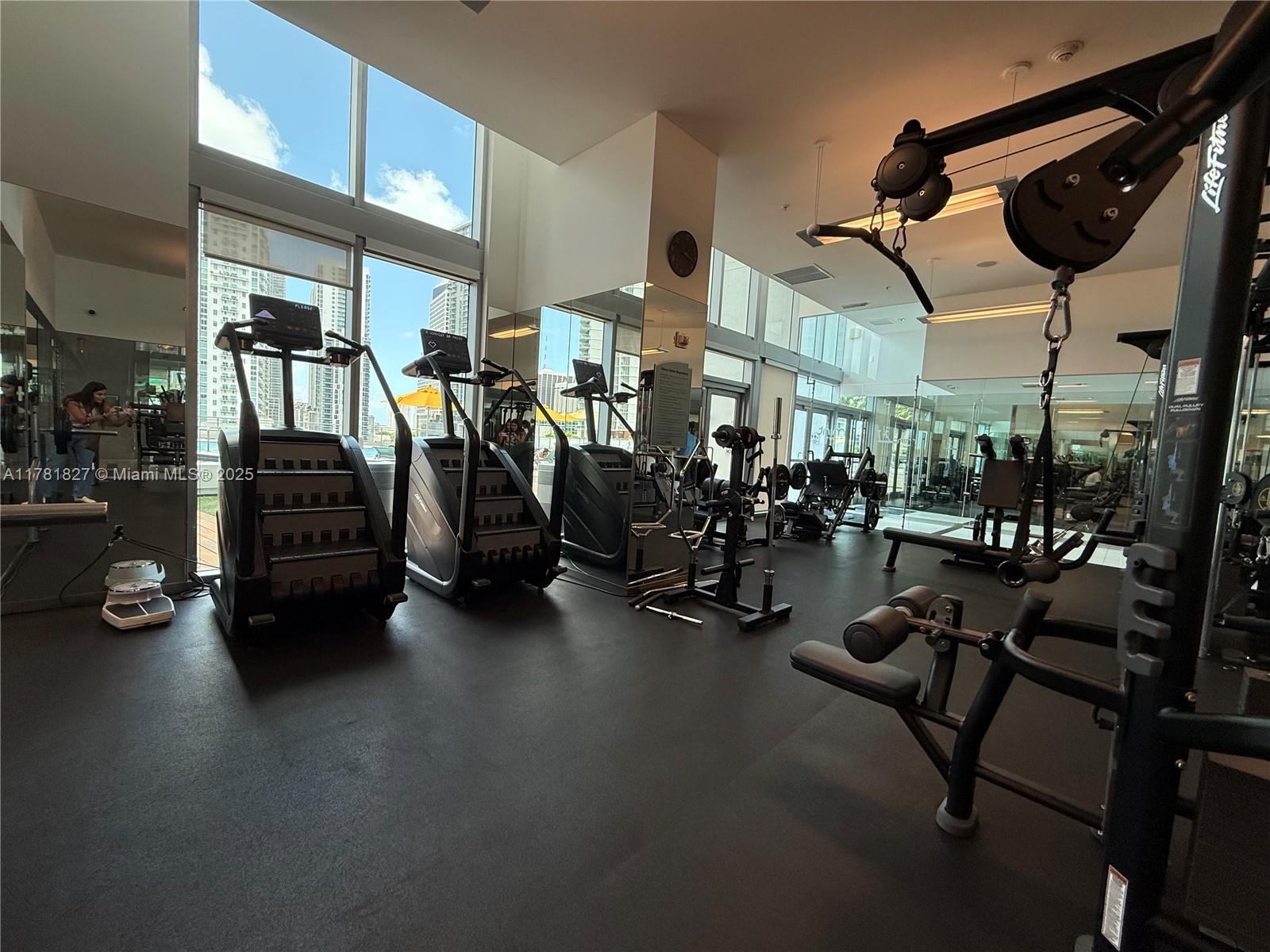 92 Southwest 3rd Street, Unit 4209 Miami, FL 33130 - Photo 24 of 31 a view of a room with gym equipment