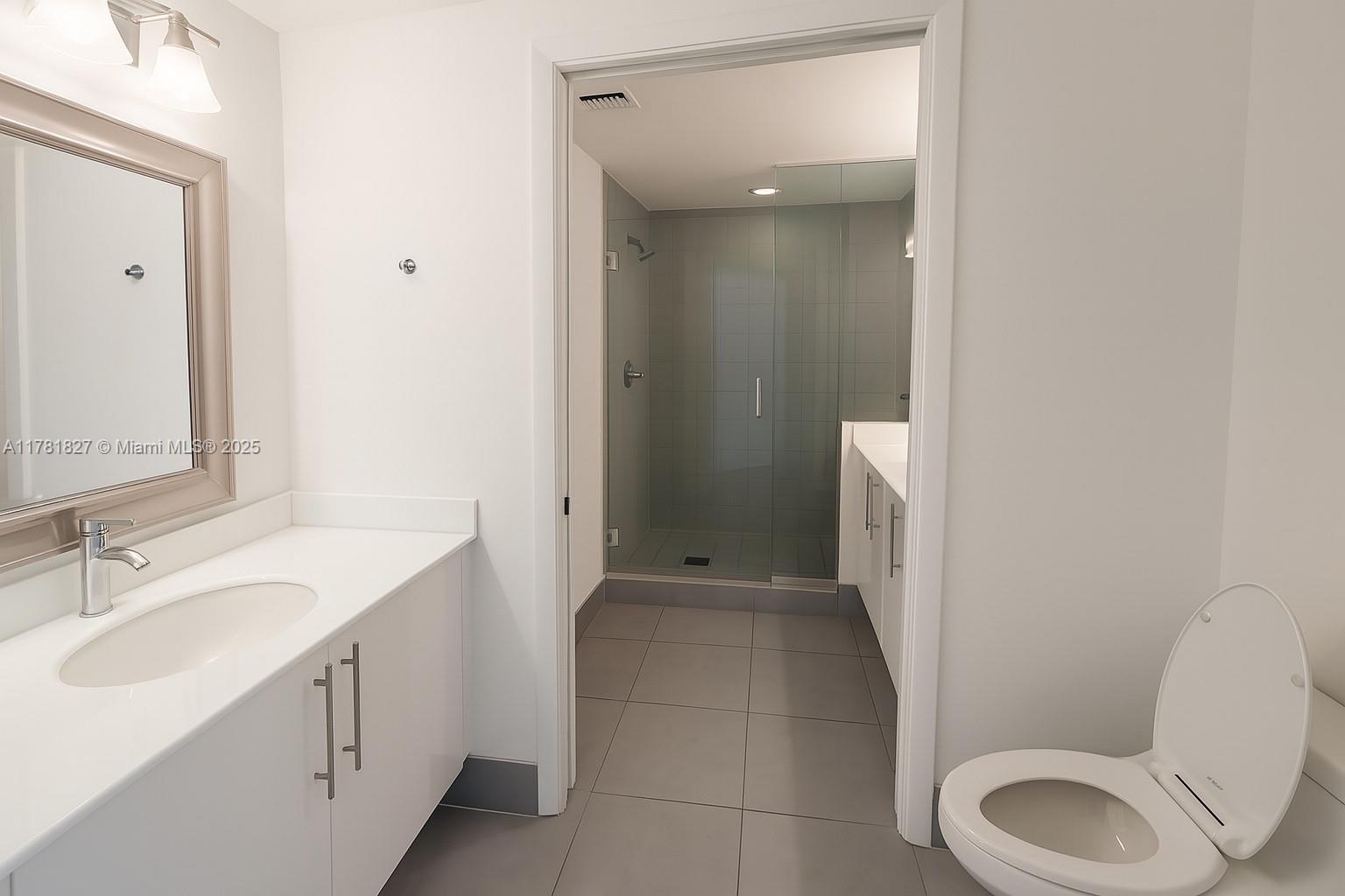 92 Southwest 3rd Street, Unit 4209 Miami, FL 33130 - Photo 8 of 31 a bathroom with a sink toilet and shower