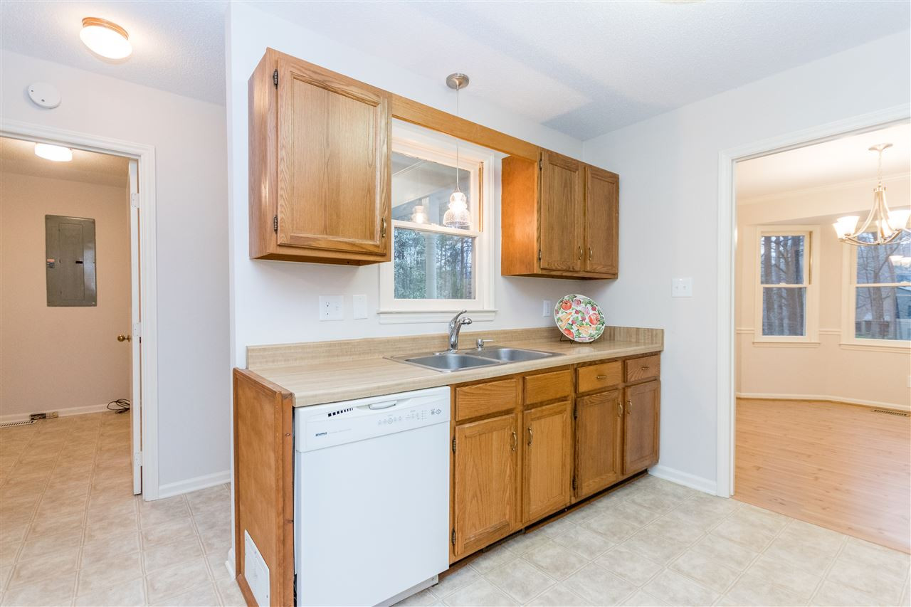 8300 Dunwood Court Raleigh, NC 27613 - Photo 3 of 18 Great storage in this house. There is a kitchen pantry, large laundry room, and a closet in the laundry room. Kitchen with view to Laundry Room