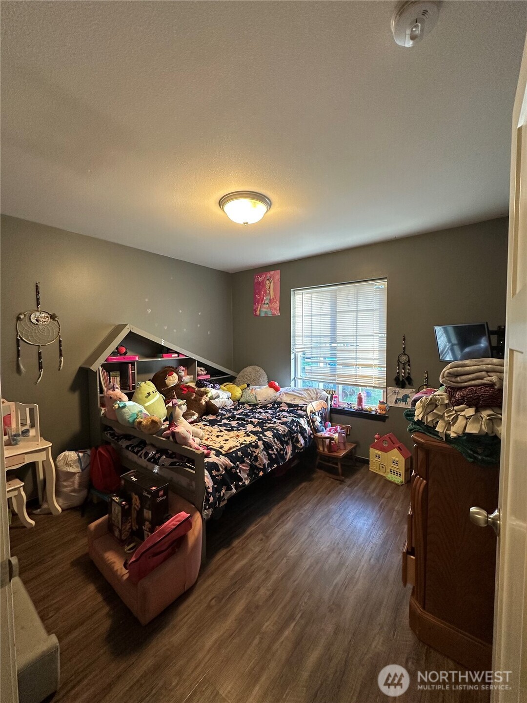 180 A Mossyrock Road West Mossyrock, WA 98564 - Photo 21 of 27 a bedroom with furniture and a wooden floor