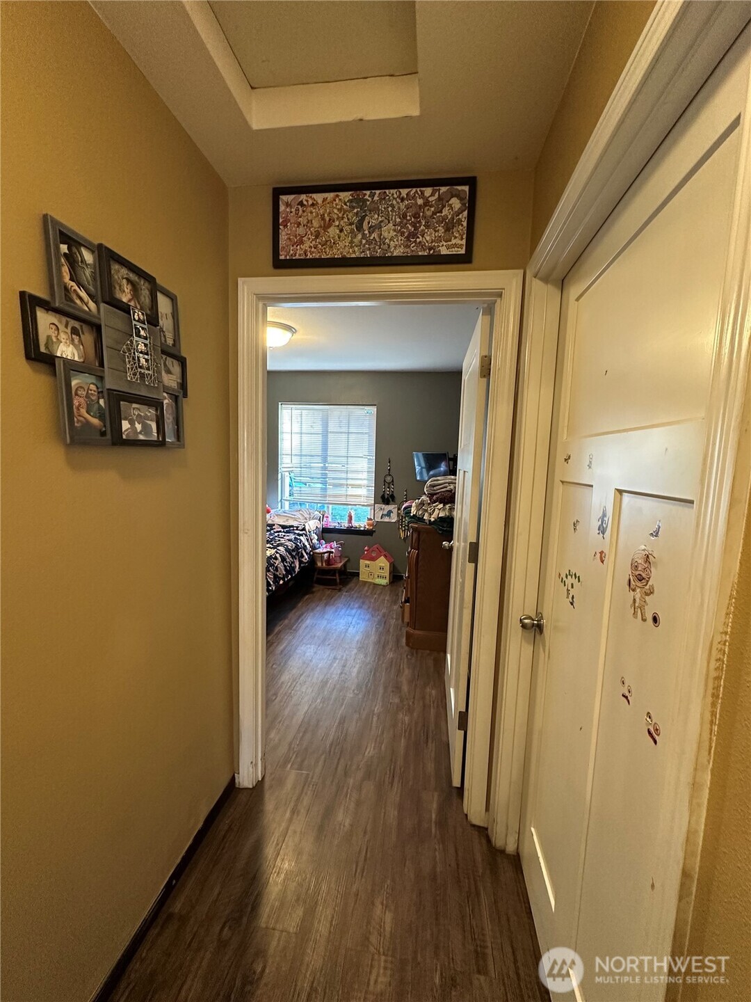 180 A Mossyrock Road West Mossyrock, WA 98564 - Photo 23 of 27 a view of a hallway with wooden floor and a living room